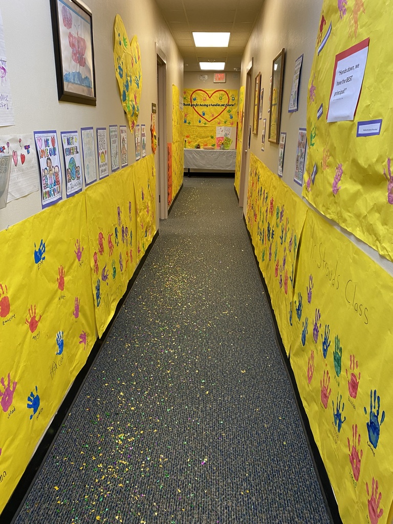 Office hallway with signs and glitter