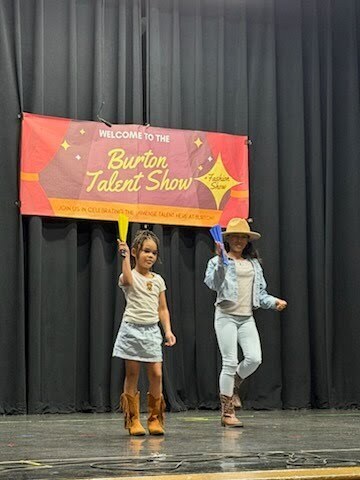 Two girls dancing on stage