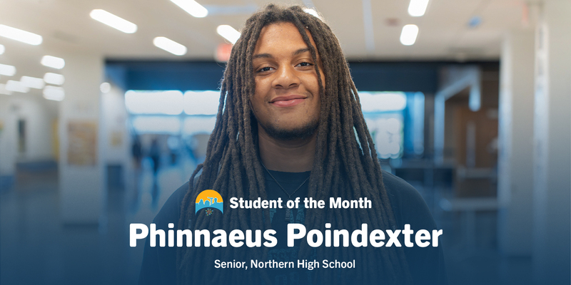 Portrait of smiling student Phinnaeus Poindexter with long locs, named Student of the Month at Senior, Northern High School; warm, proud tone.