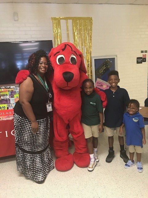 Teacher and 3 boys with Clifford