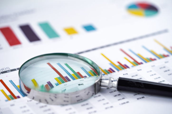 Image of a magnifying glass over statistics