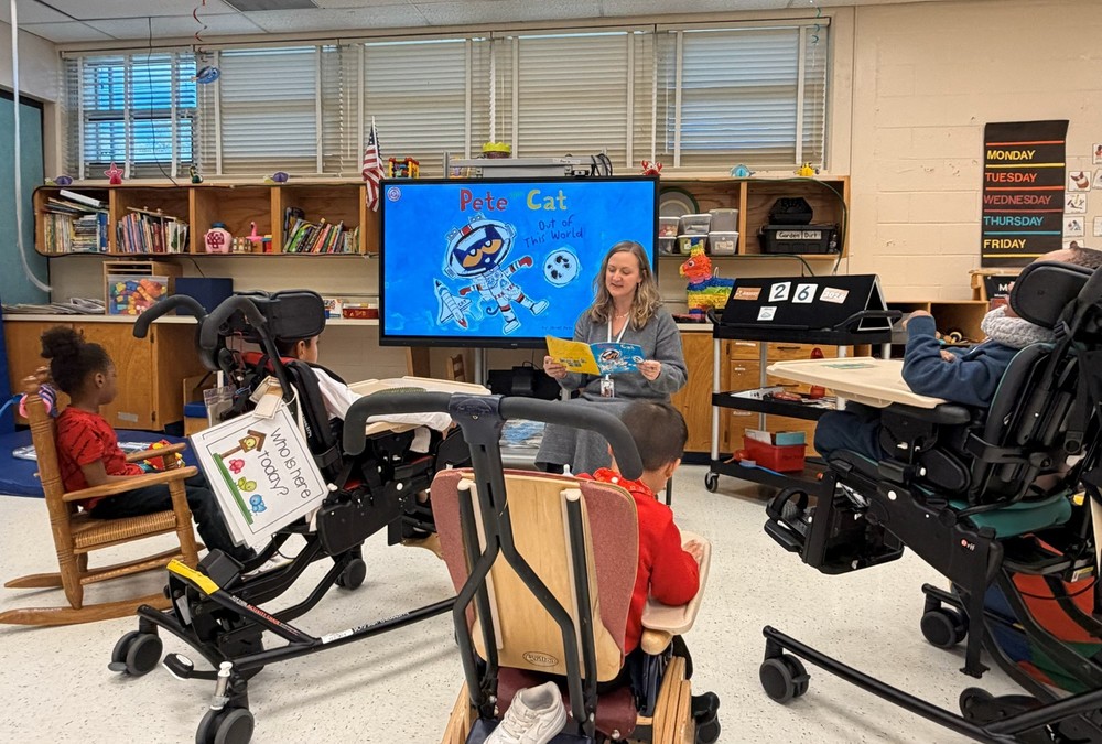 Teacher reading in the class