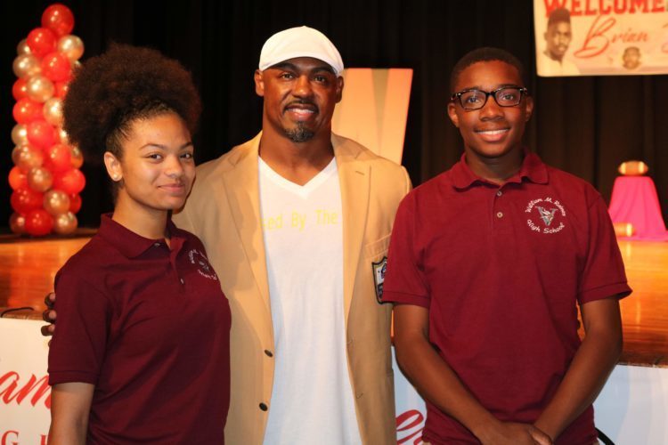 Brian Dawkins with 2 students