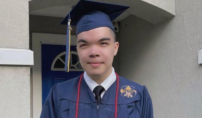 Kai Edu in cap and gown