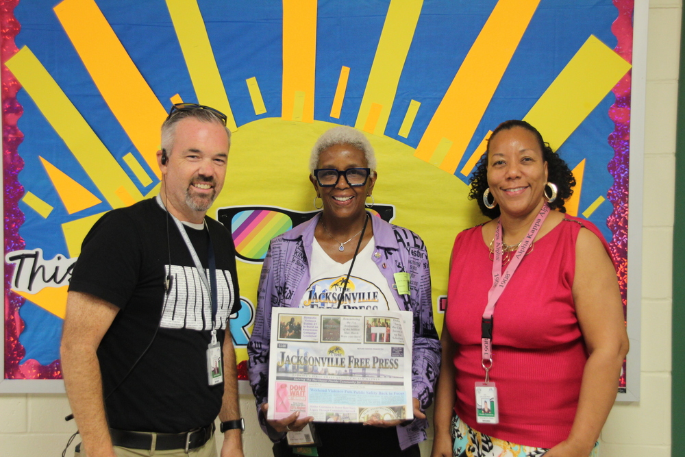 Picture of teacher and principal with the Jacksonville Free Press