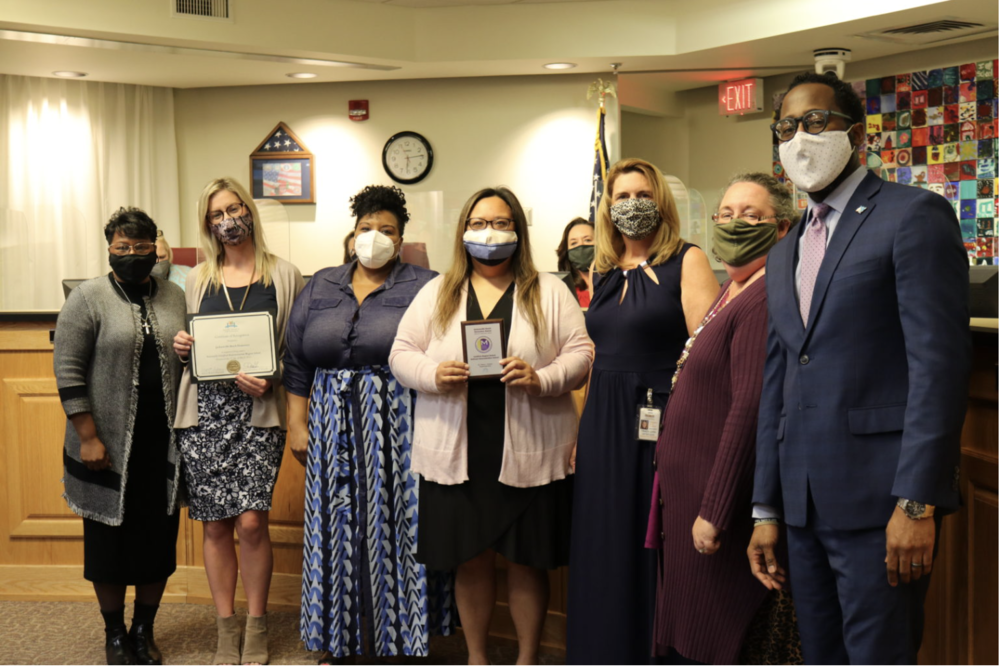 Jax Beach Elementary staff holding their award