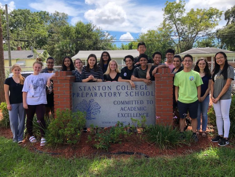 College Preparatory students posing with "Stanton College Preparatory School" sign