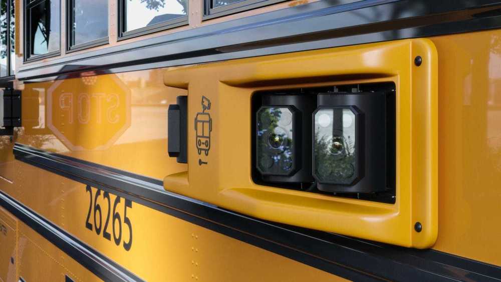 yellow school bus with a camera mounted on it