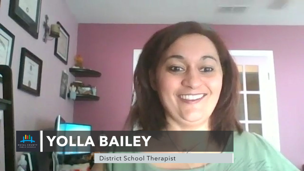 Lady looking at camera smiling.