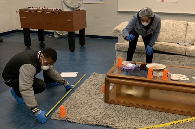 Students investigate a crime scene 