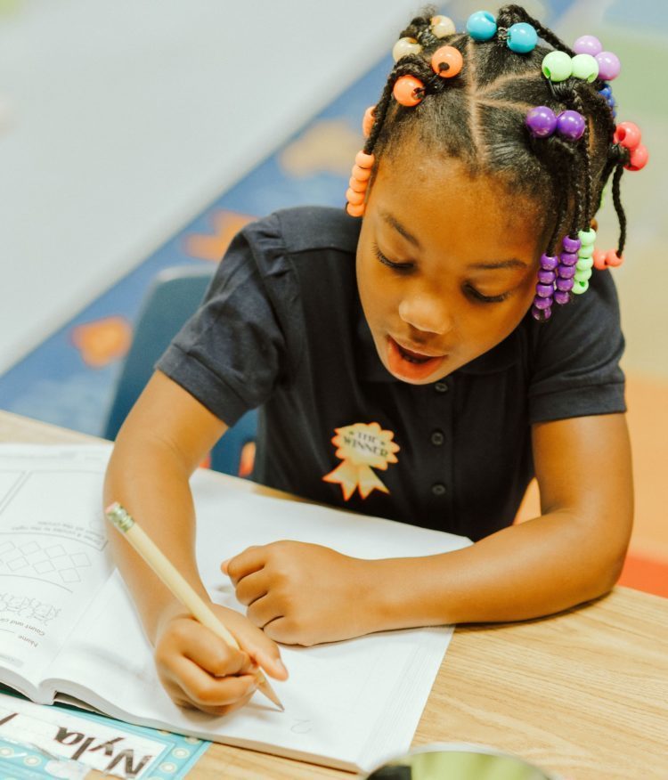 Student working in a workbook.
