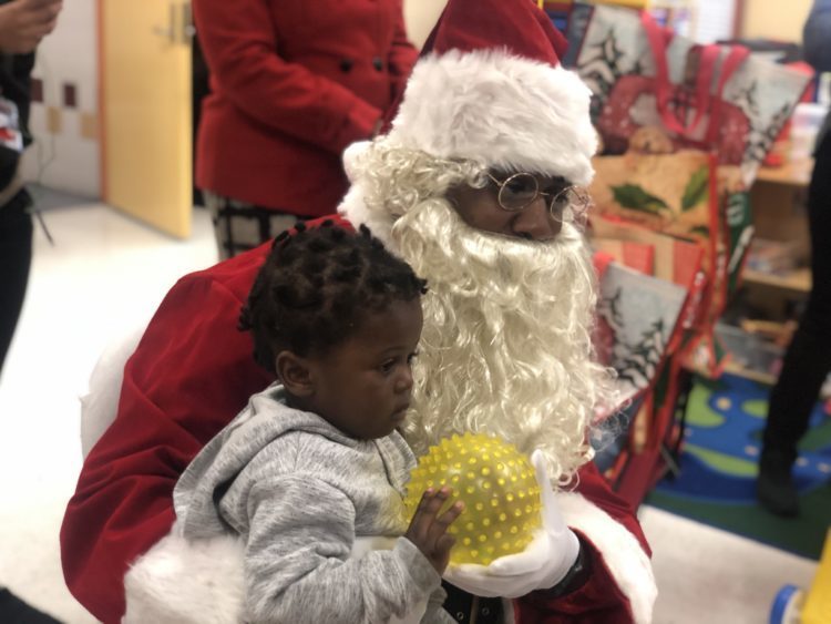 Santa, holding child