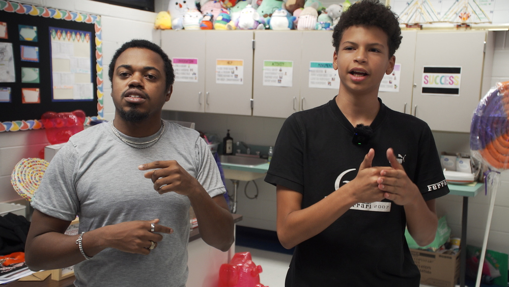 Deaf and Hard of Hearing Program at Landmark Middle School - an interpreter and student