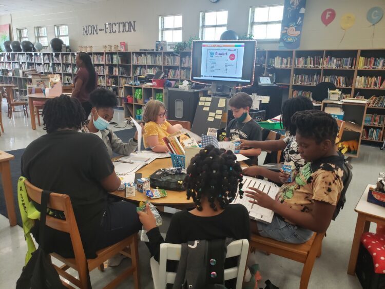 students at a library table