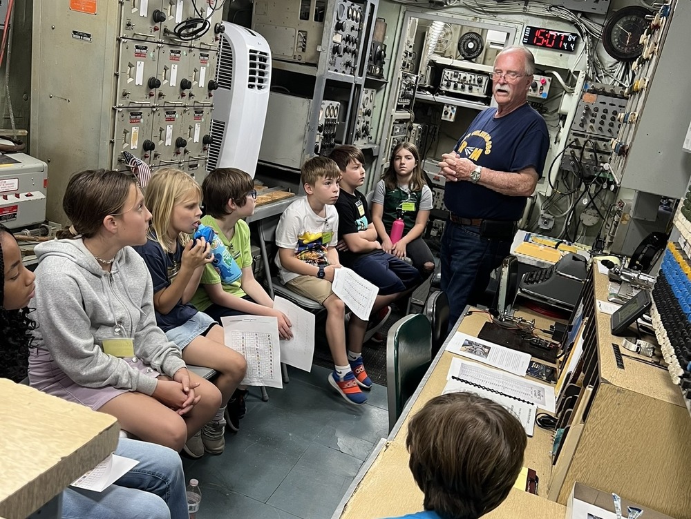 Loretto Elementary School students listen to an instructor during their field trip