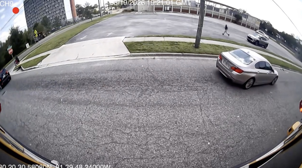 Bus stop arm camera image shows close call with student