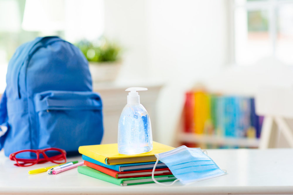 School backpack, notebooks and  hand sanitizer