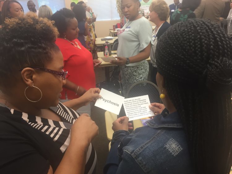 mental health reunion, 2 women reading cards