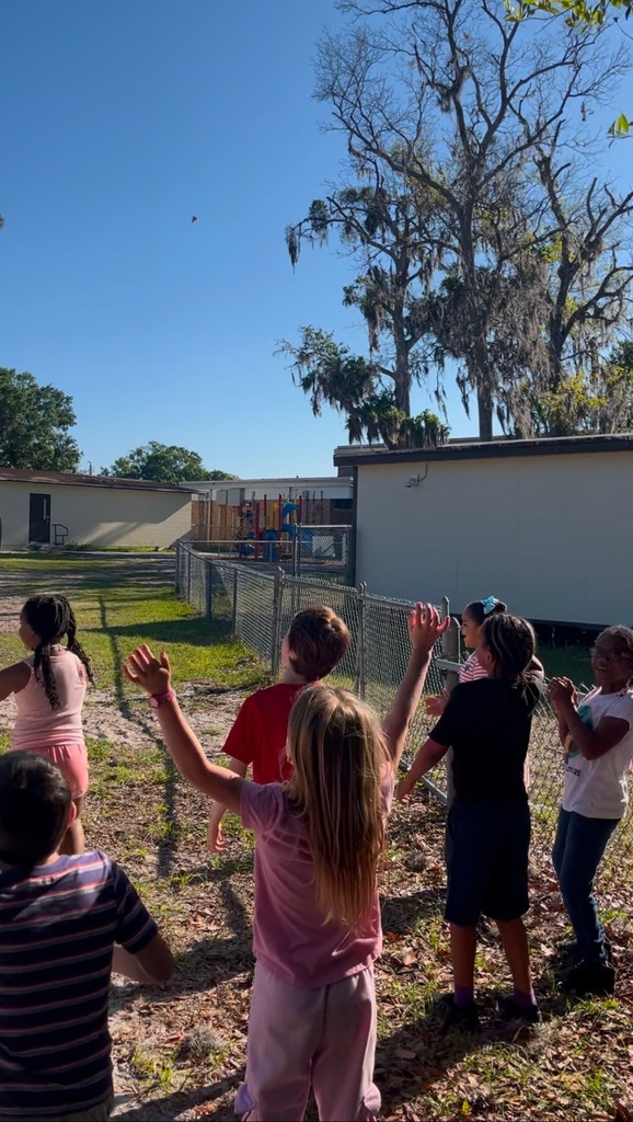 The children saying goodbye to the butterflies.