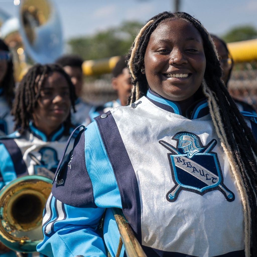 marching band students smiling for the photo
