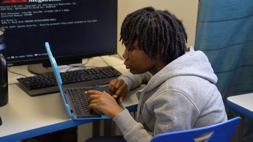 Close-up of a student working on a 3D world in Minecraft, part of a lesson in Fisher’s ICT class.