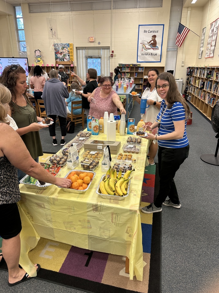 Teachers enjoying breakfast items