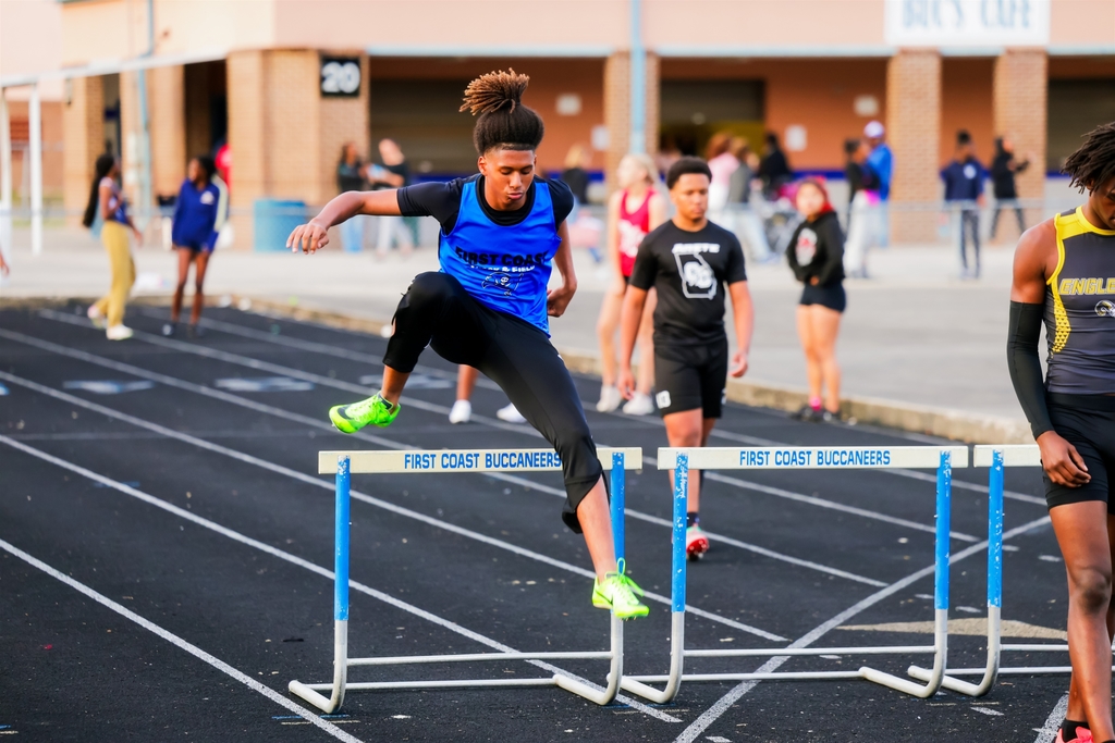 Student doing hurdles doing track meet