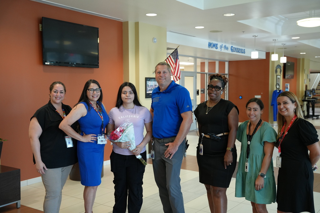 Andrea, a student at Riverside High School, accepts recognition for her inspiring Hispanic Heritage Essay.