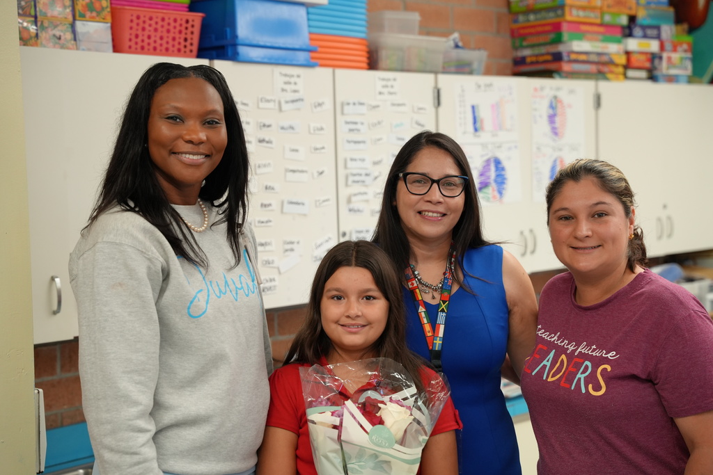 Nathalie, a student at Beauclerc Elementary, smiles as she is honored for her award-winning Hispanic Heritage Essay