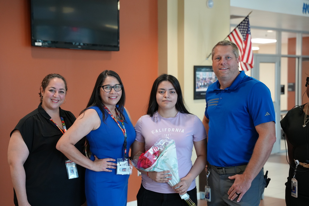 Andrea, a student at Riverside High School, accepts recognition for her inspiring Hispanic Heritage Essay.