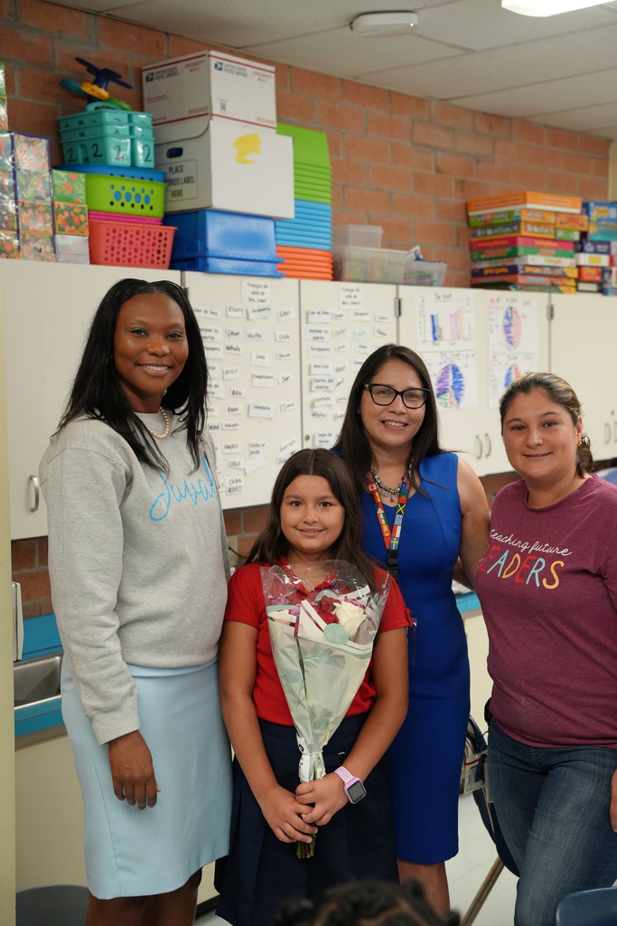 Nathalie, a student at Beauclerc Elementary, smiles as she is honored for her award-winning Hispanic Heritage Essay