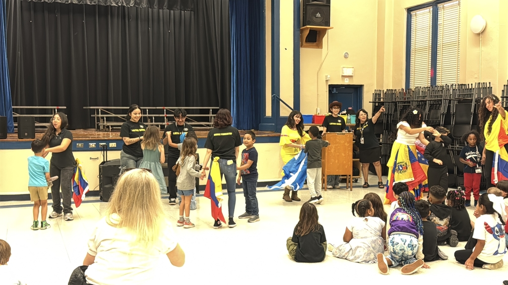 Latino rams dancing with West Riverside students.