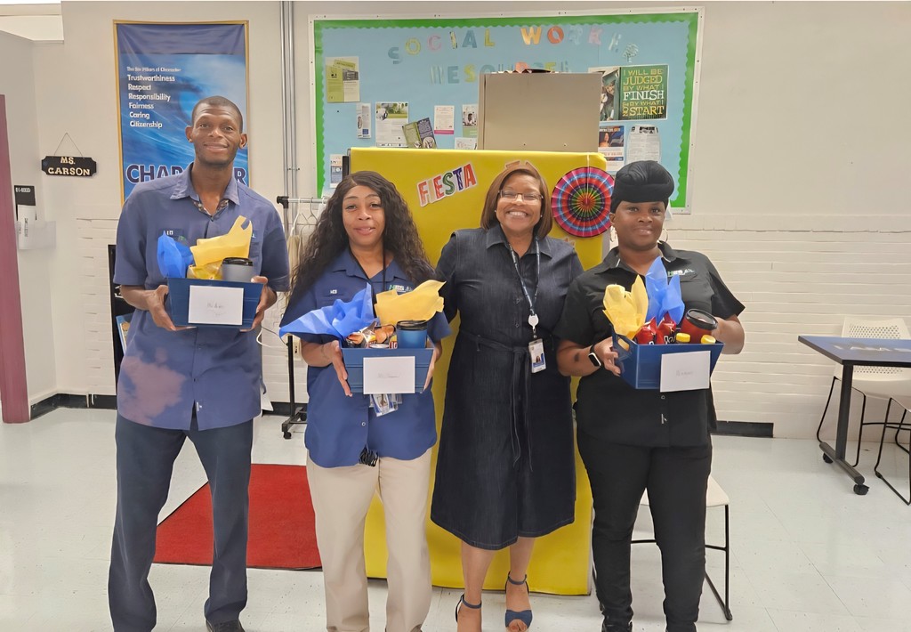 Picture of Principal Milliner-Smith with our custodial staff
