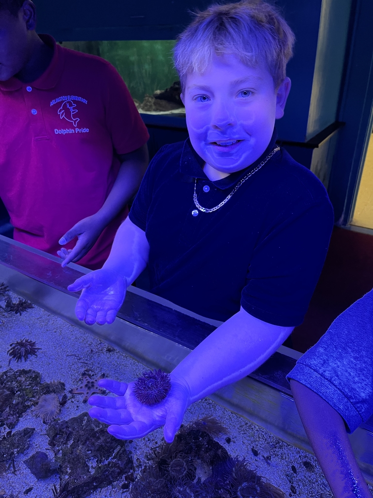 Student holding sea creature