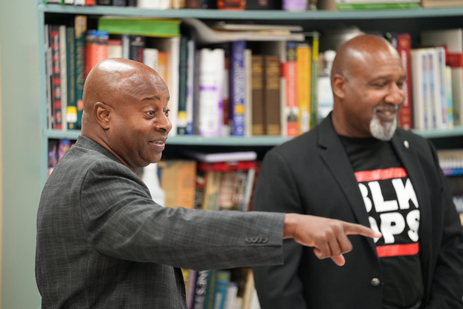 The BLKOPS Foundation presenter gestures while explaining the legacy of Florida veterans to a classroom of engaged Westside High students.