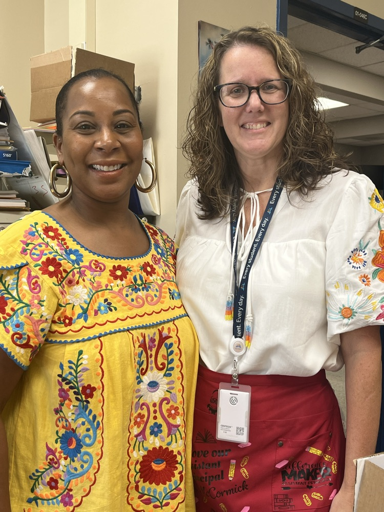principal McCormick and Ms Depriest in their floral