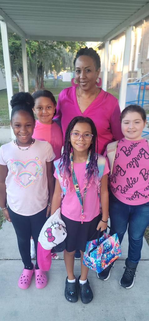 Students and teacher in pink
