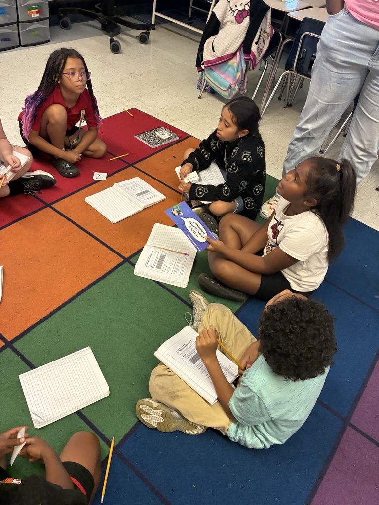 students sitting in a circle having a discussion