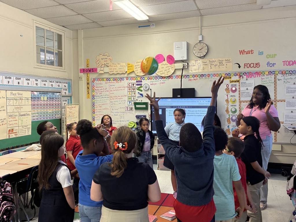 students in a circle throwing beach ball for discussion questions