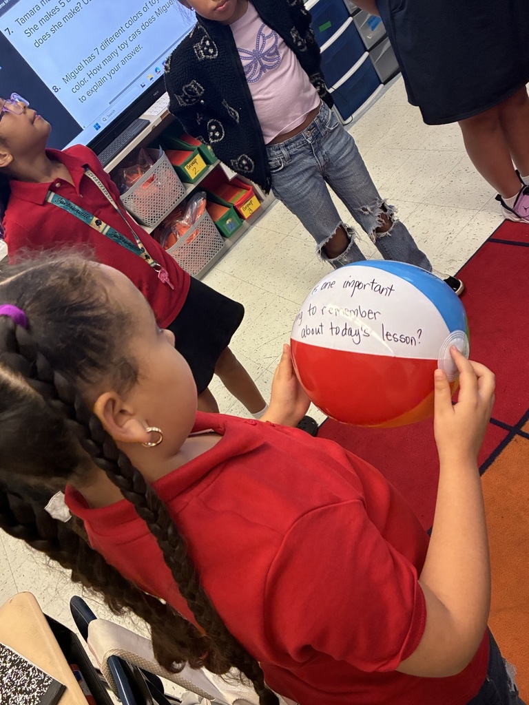 Student holding beachball with question stem written on it