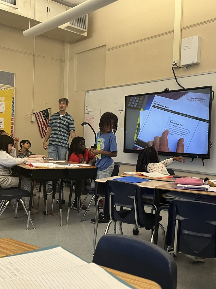 Mr hodgson leading the class