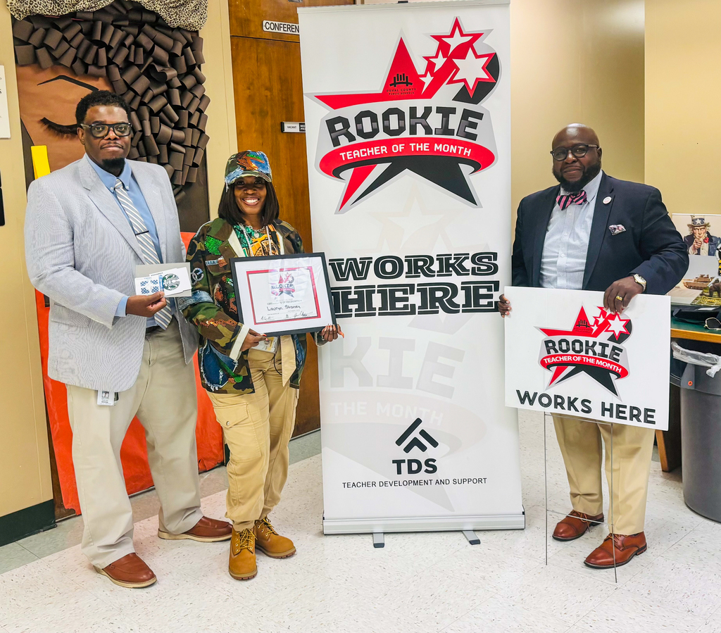 DCPS and Edward H. White High School staff gather to celebrate the October Rookie Teacher of the Month recognition.