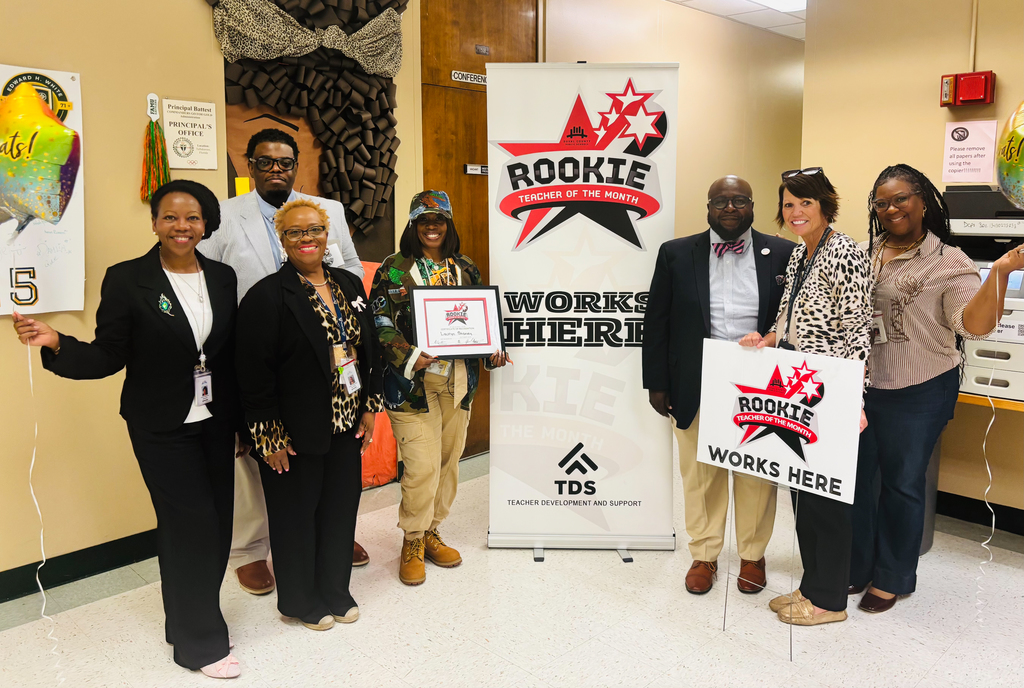 DCPS and Edward H. White High School staff gather to celebrate the October Rookie Teacher of the Month recognition.