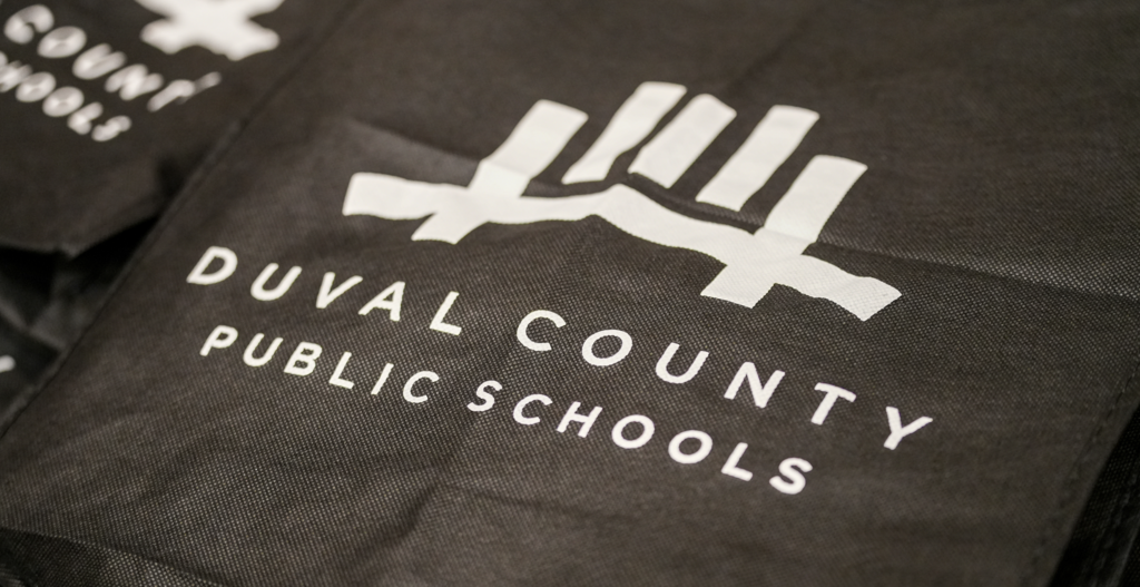 Close-up of a Duval County Public Schools tote bag displayed on a table during the Intern Day event.