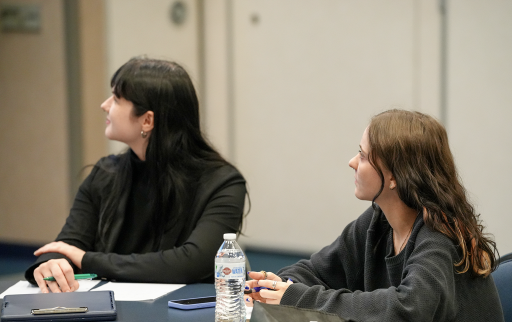 A Duval County Public Schools leader talks with University of North Florida students during the “From Campus to Classroom” event at the Schultz Center for Teaching & Leadership.