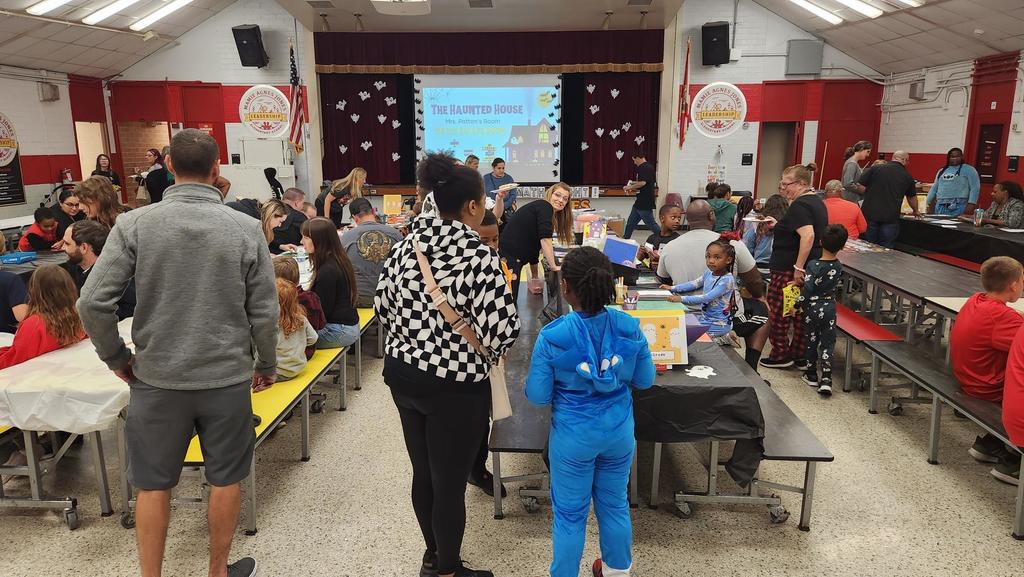 Families participating in hands on math activities with their students at MAJ.