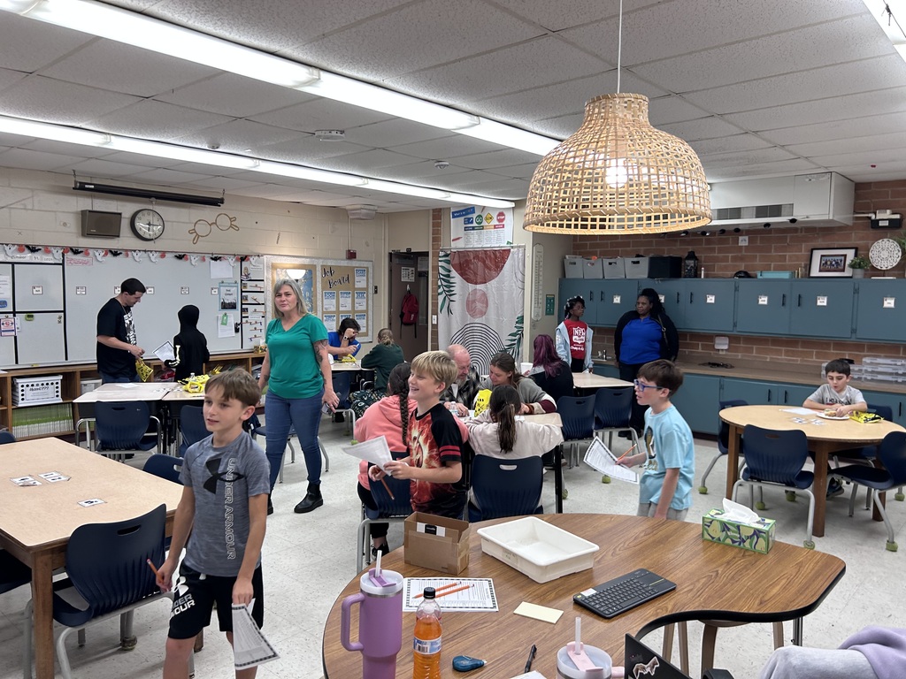 Families participating in hands on math activities with their students at MAJ.