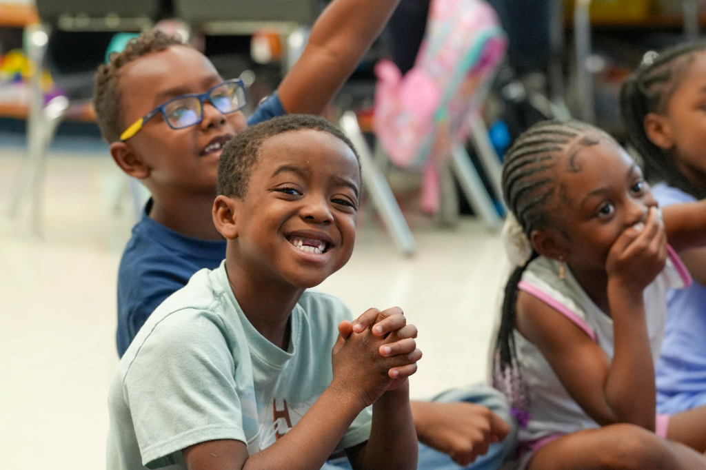 Teacher Angie Collins shares a laugh with her students, creating a joyful classroom atmosphere at Ramona Boulevard Elementary.