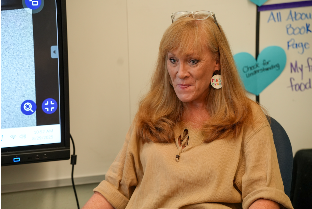 Angie Collins, a veteran teacher at Ramona Boulevard Elementary, smiles while speaking to her students during class.