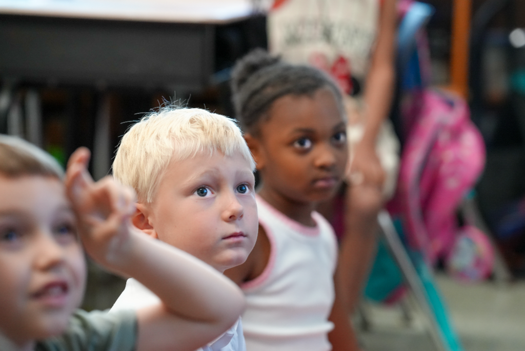 Students eagerly participate in a classroom discussion led by Angie Collins at Ramona Boulevard Elementary.